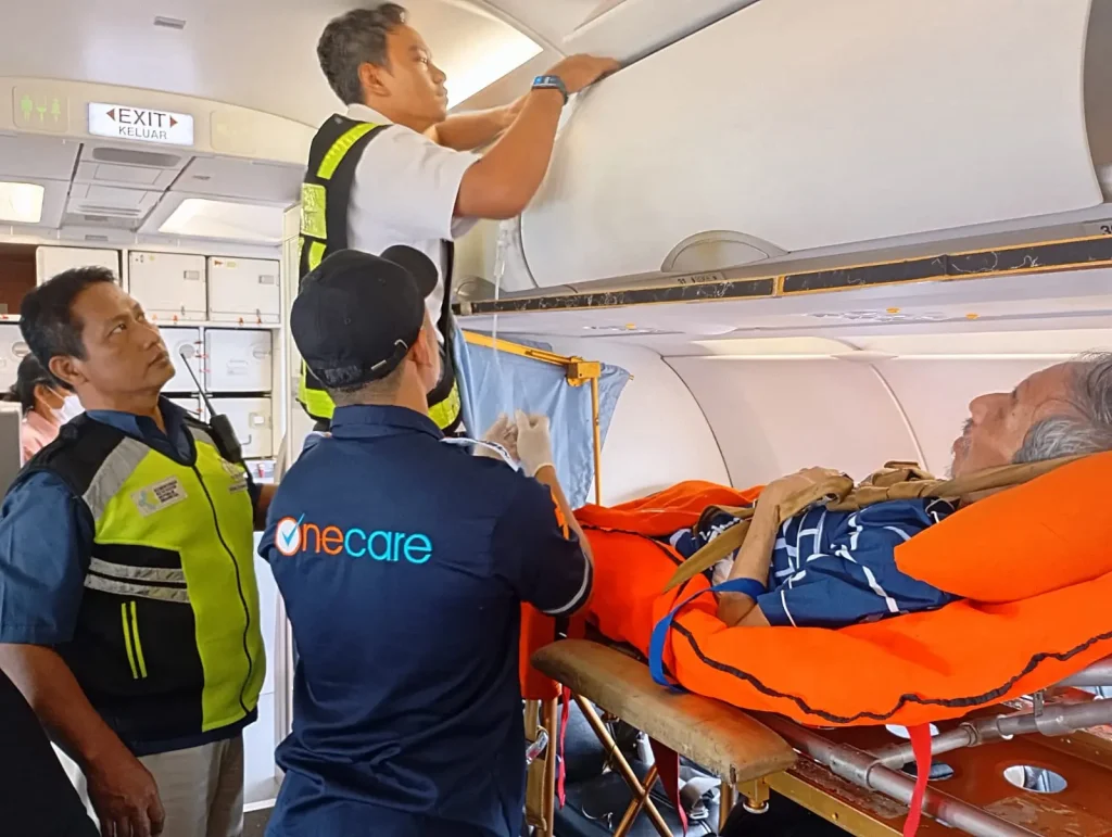 Medical evacuation Jakarta crew securing a patient inside the aircraft cabin before departure