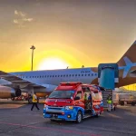 Aircraft used for medical evacuation Indonesia services parked on the tarmac at sunset