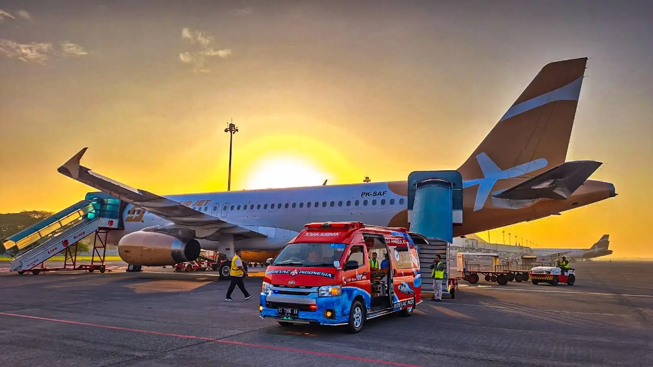 Aircraft used for medical evacuation Indonesia services parked on the tarmac at sunset